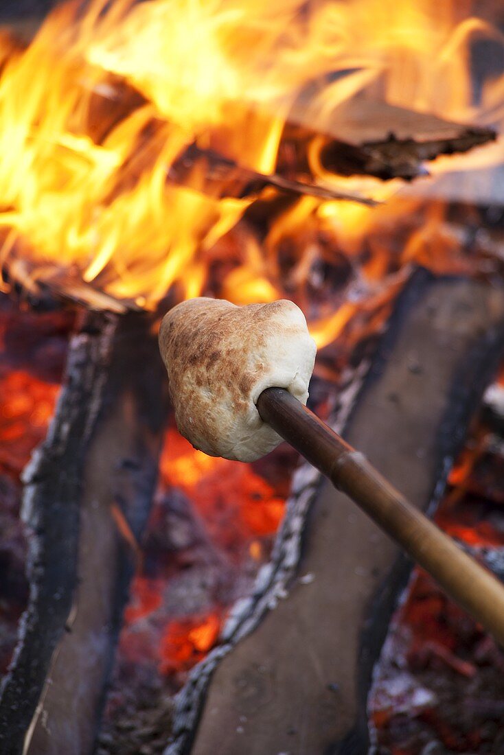 Stick bread over a campfire