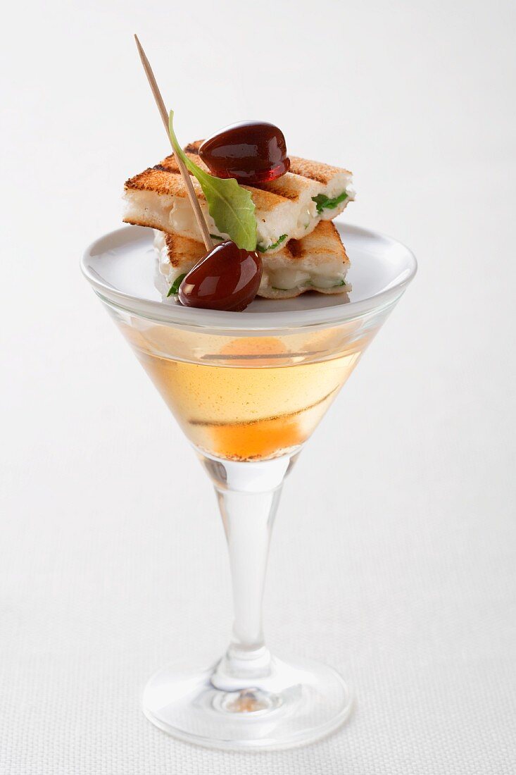 Martini and a goats' cheese toast canape