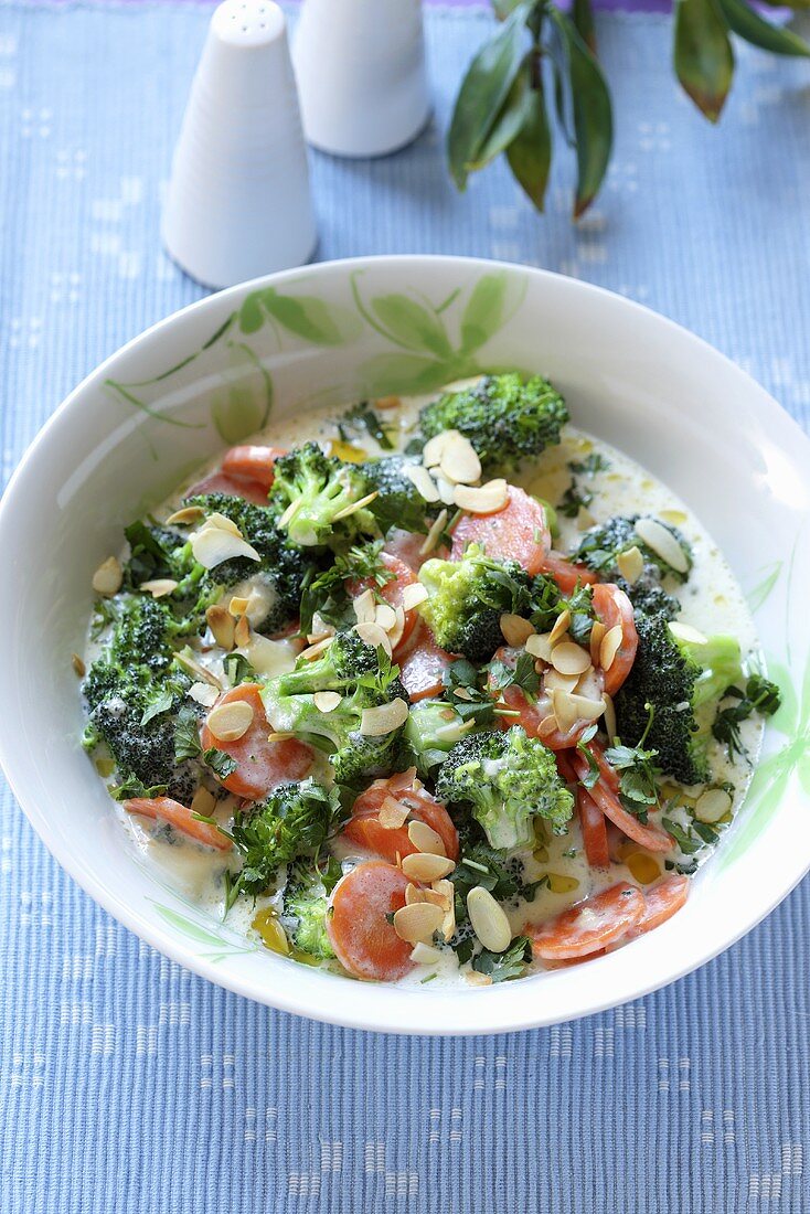 Broccoli with carrots and slivered almonds in a cream sauce