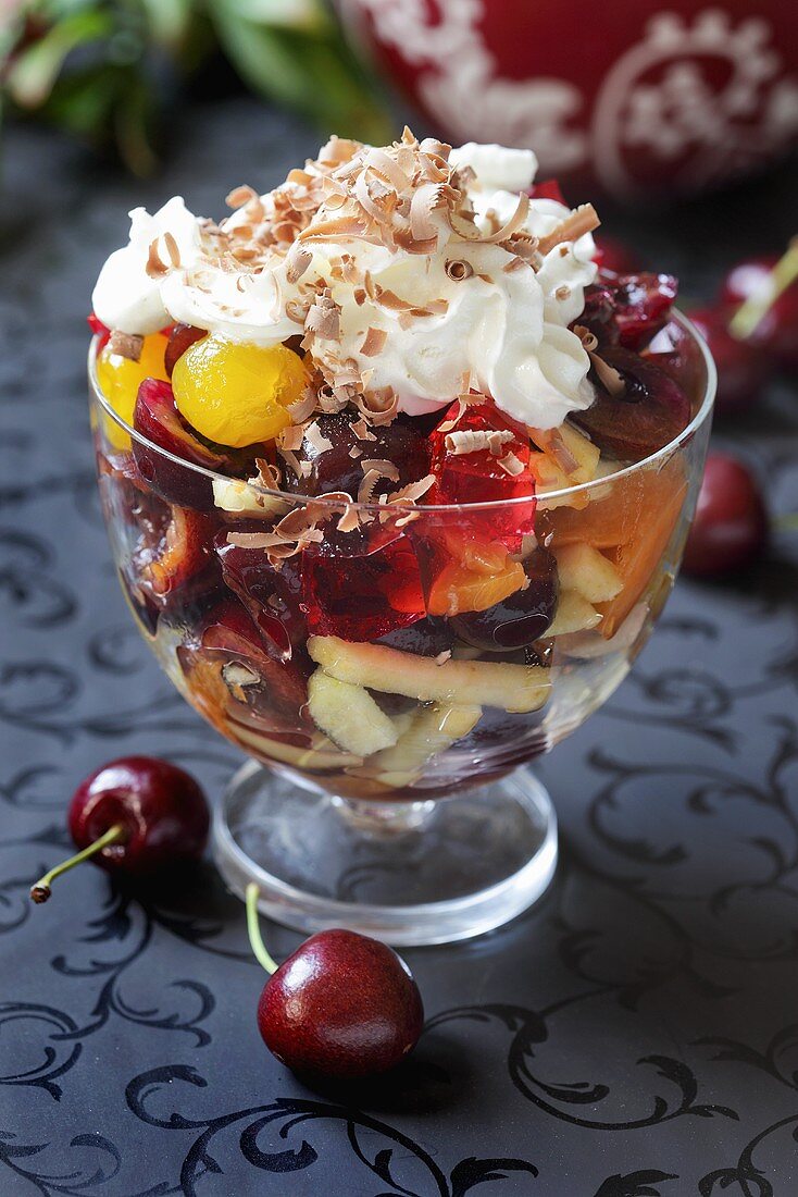 Fruit salad topped with cream