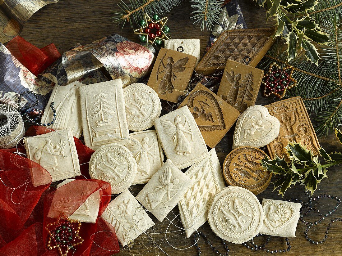 Various Springerle (German Christmas shortcrust biscuits), cutters and gift ribbon