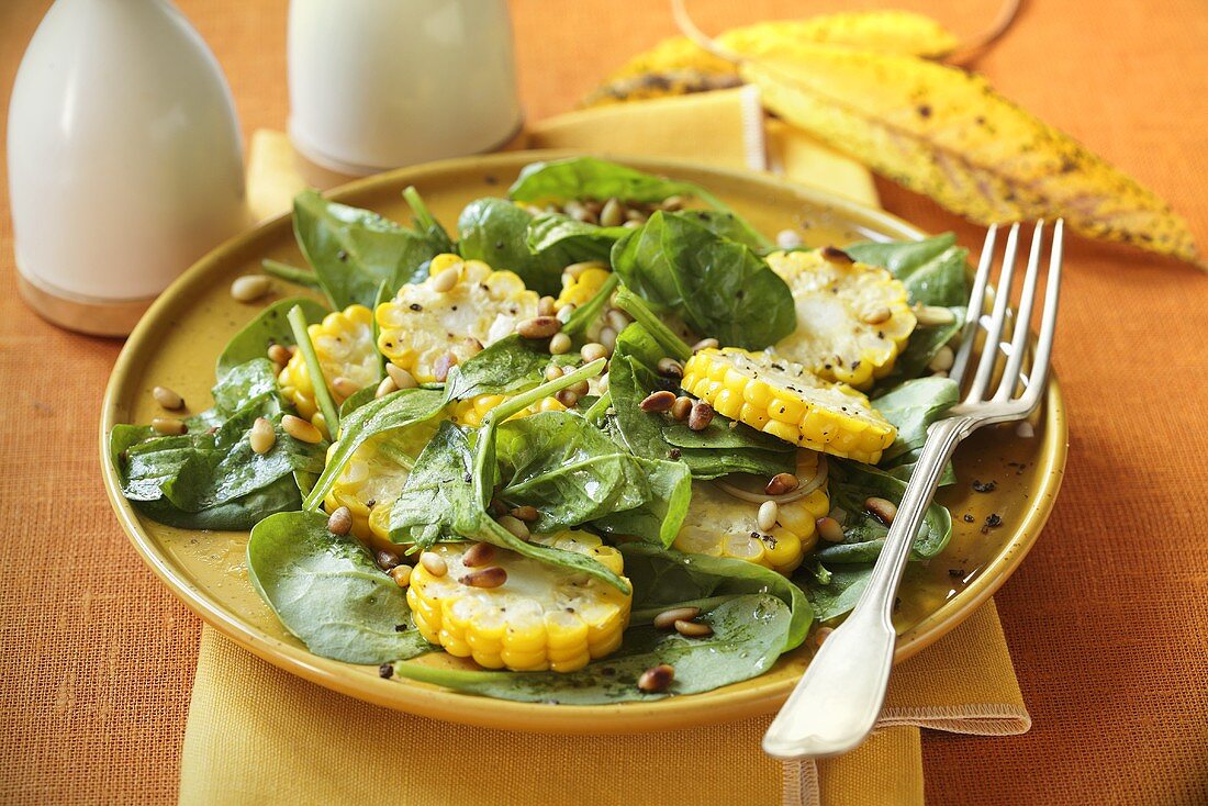 Spinach salad with sweetcorn and pine nuts