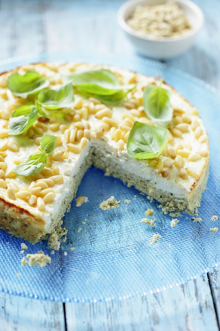 Cream cheese cake with pesto and pine nuts