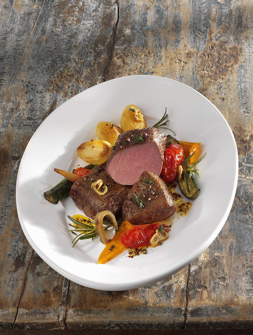 Saddle of lamb with oven-baked vegetables