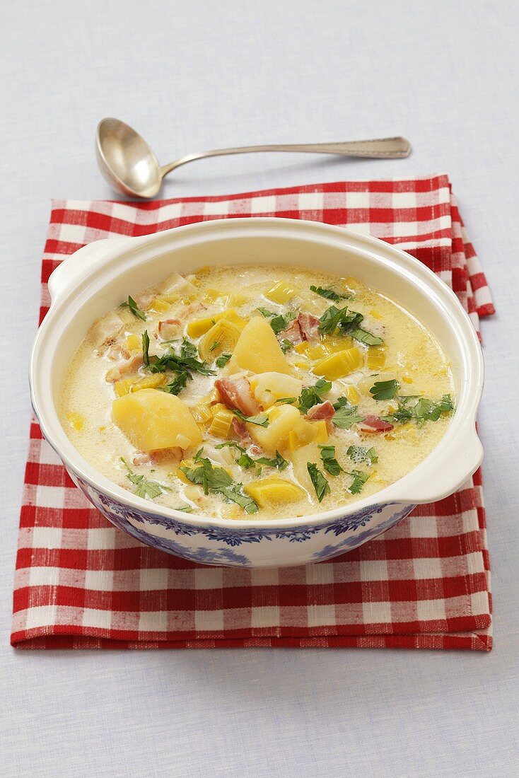 Leek and potato soup with sour cream and bacon