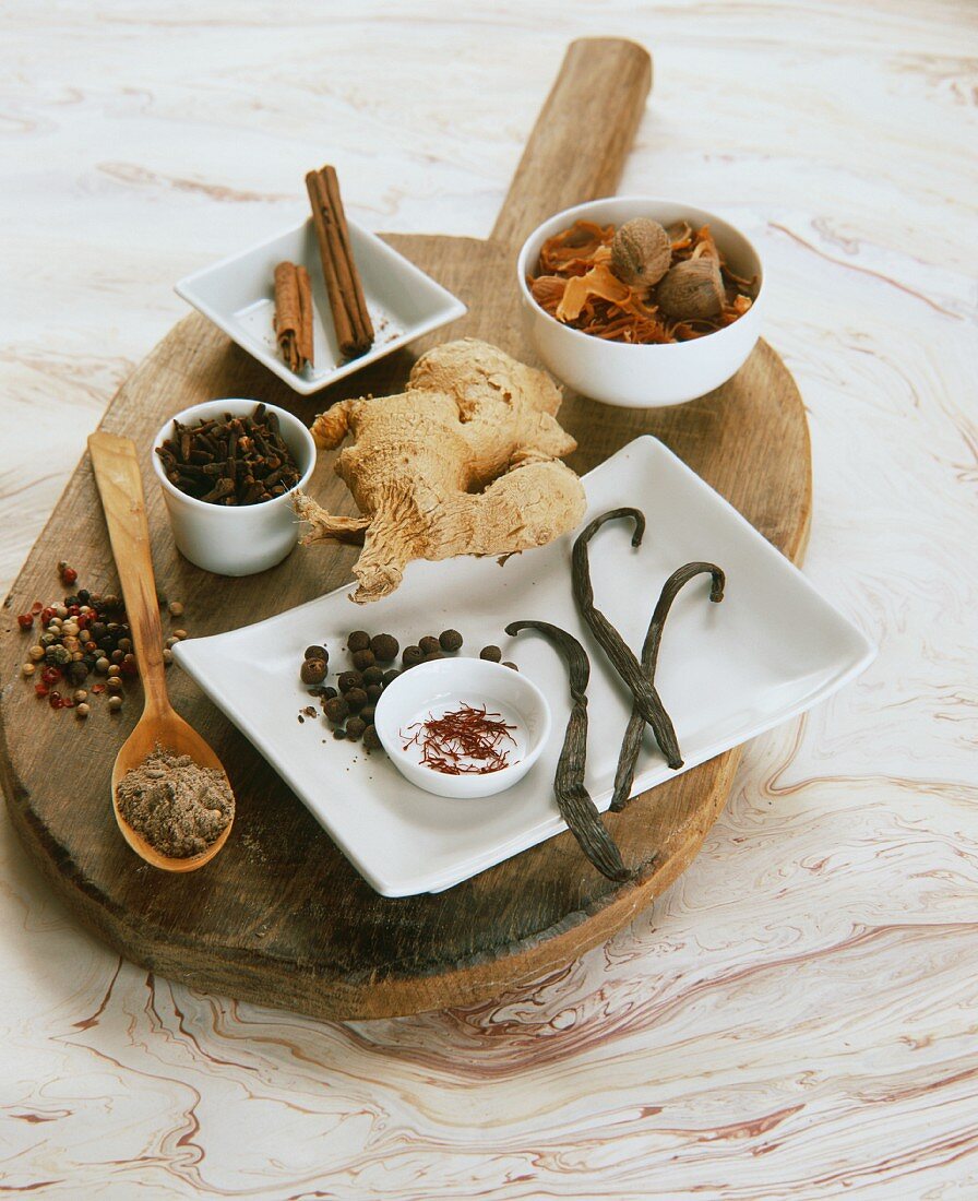 Assorted spices on wooden board