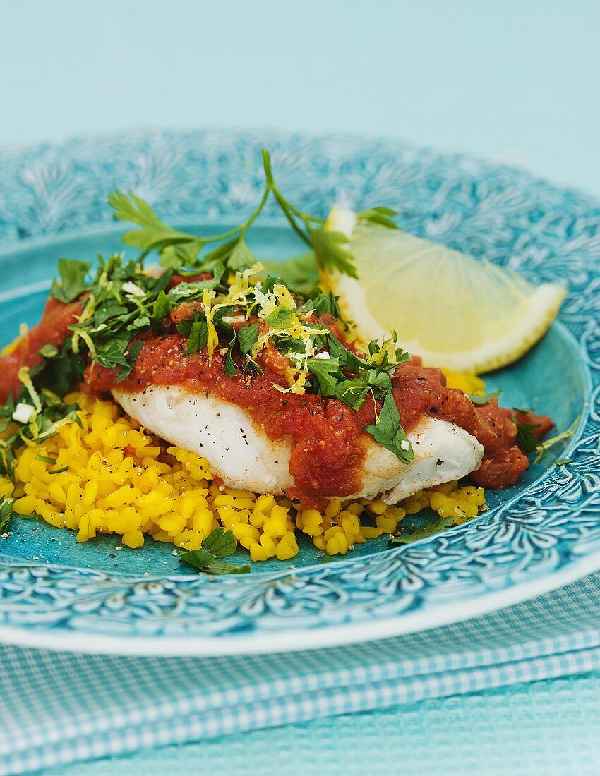 Cod with tomato sauce on saffron bulgur