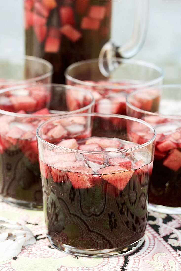 Sangria in glass jug and glasses