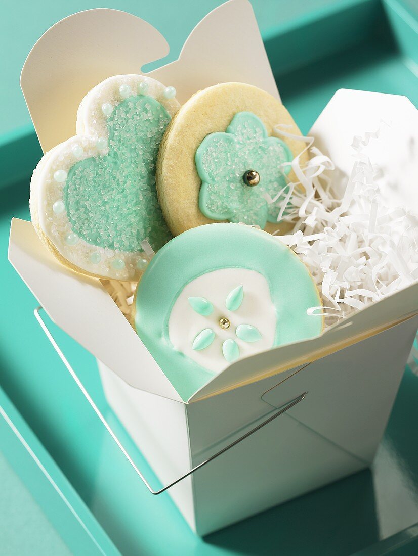 Decorated biscuits in a take-away box