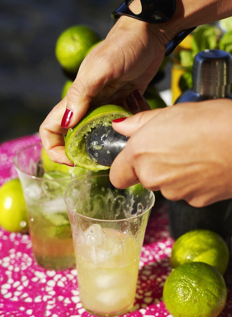 Squeezing a lime for a cocktail
