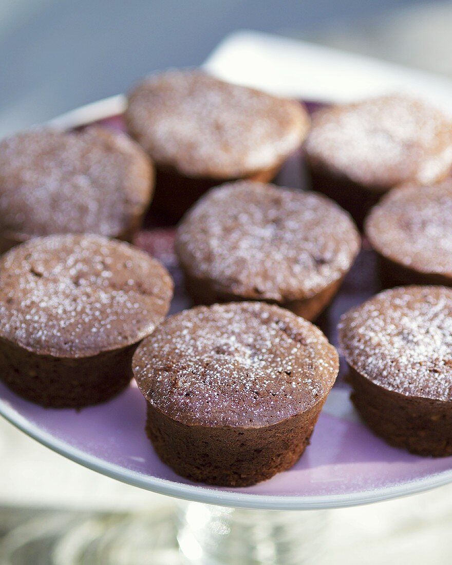 Chocolate muffins on a cake plate