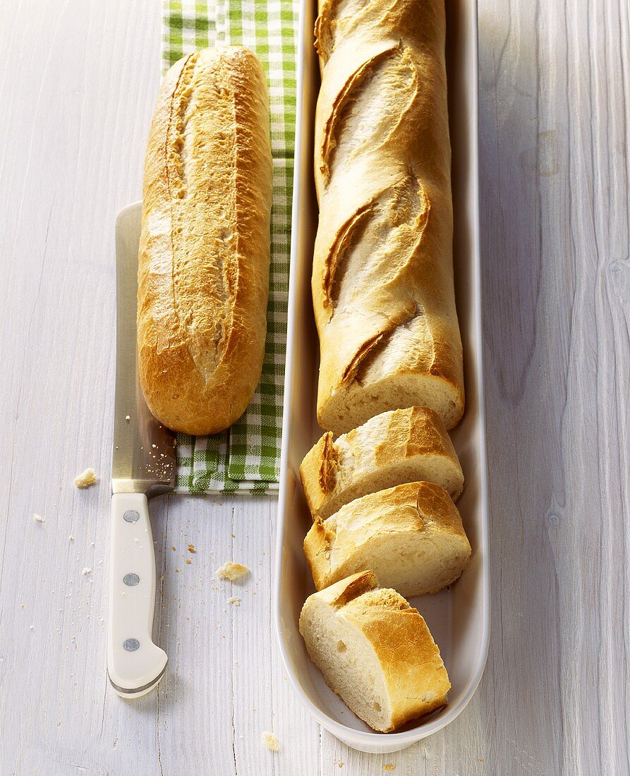 Whole and partly sliced baguettes