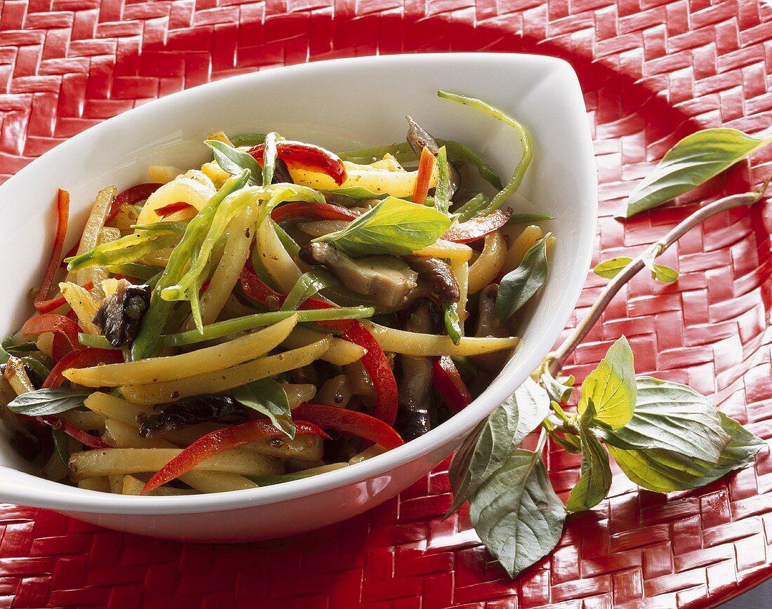 Fried potatoes and vegetables with shiitake mushrooms