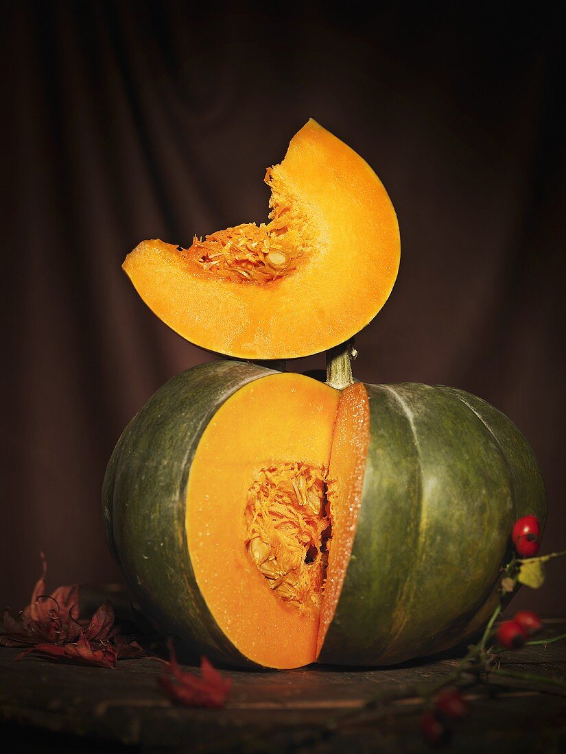 A pumpkin with a slice removed