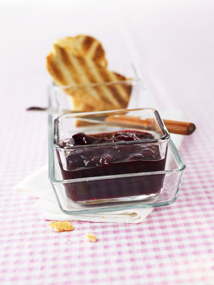 Cherry jam in glass dish
