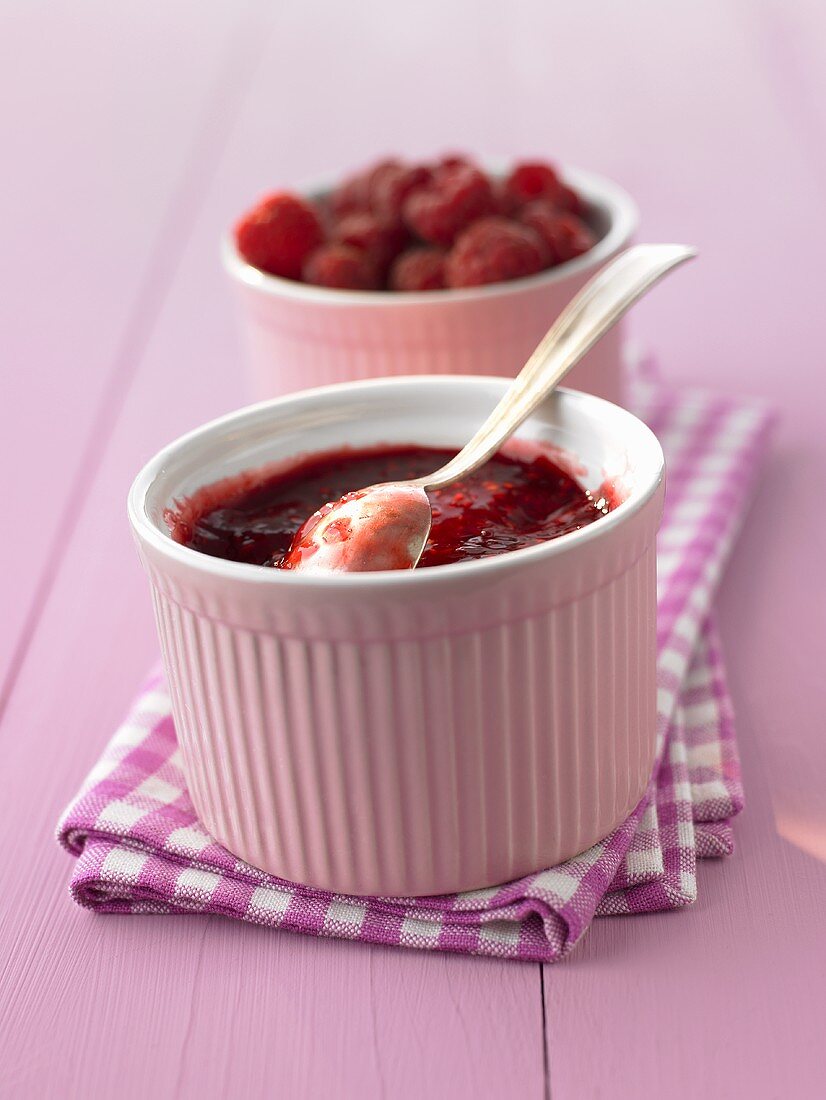 Raspberry jam in a pink ramekin