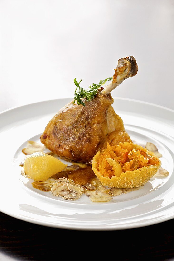 Roasted goose leg with baked pumpkin and chestnut