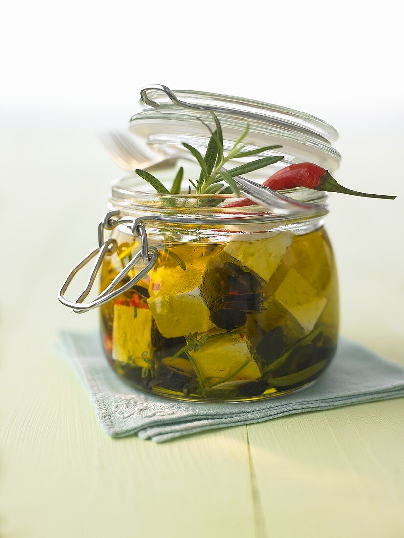 Pickled sheep's cheese with chillies and rosemary