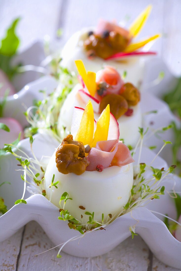 Boiled eggs stuffed with ham, mushrooms, peppers and cress