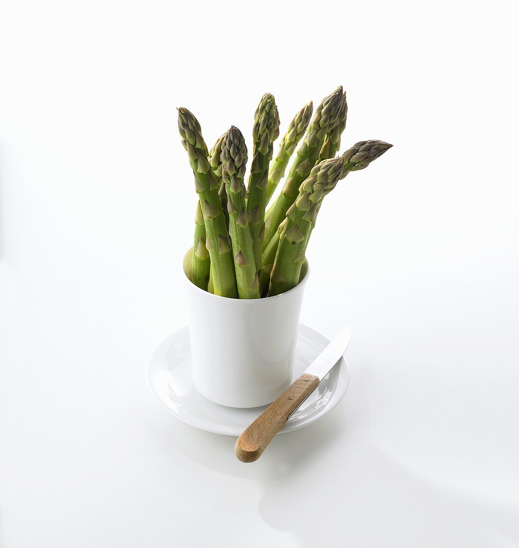 Green asparagus in a beaker
