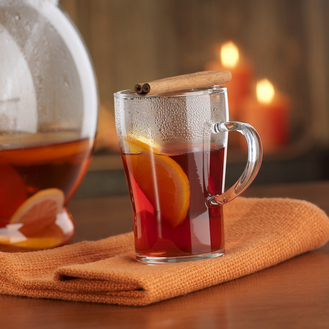 Hot punch in glass with cinnamon stick