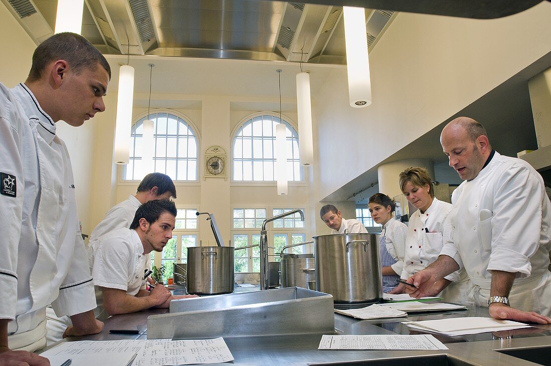 Head chef giving instructions before start of service