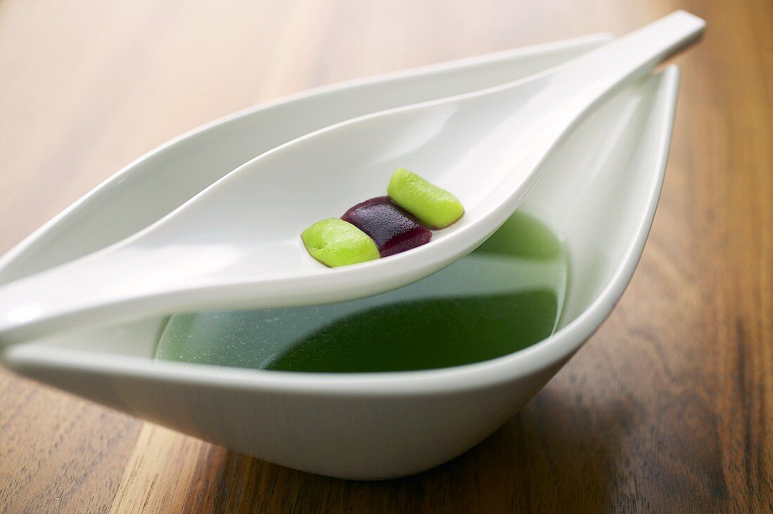 Vegetable gnocchi with spring herb soup (molecular gastronomy)