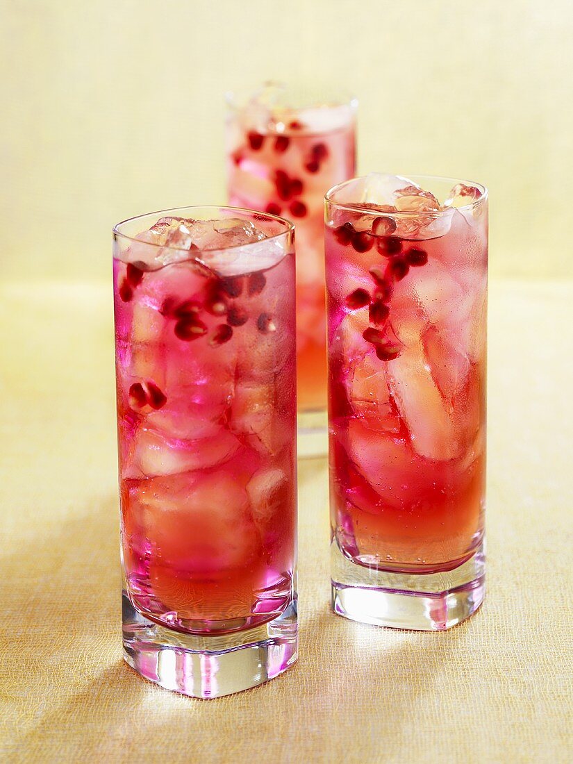 Three pomegranate drinks