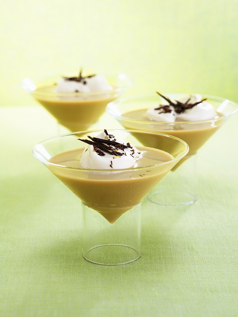 Three coffee cocktails with cream and grated chocolate