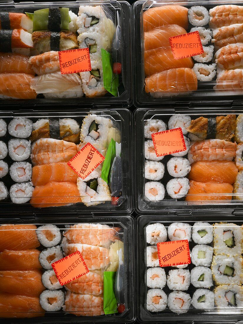 Sushi in plastic boxes with 'Reduced' labels