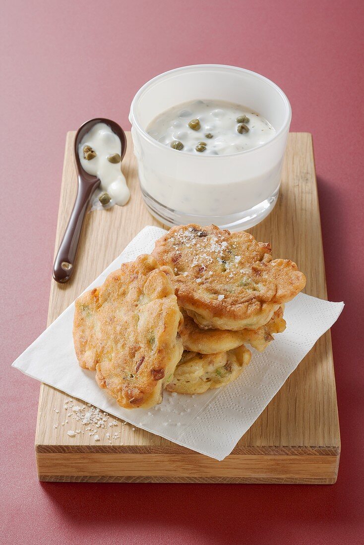 Ham and mushroom cakes with caper sauce