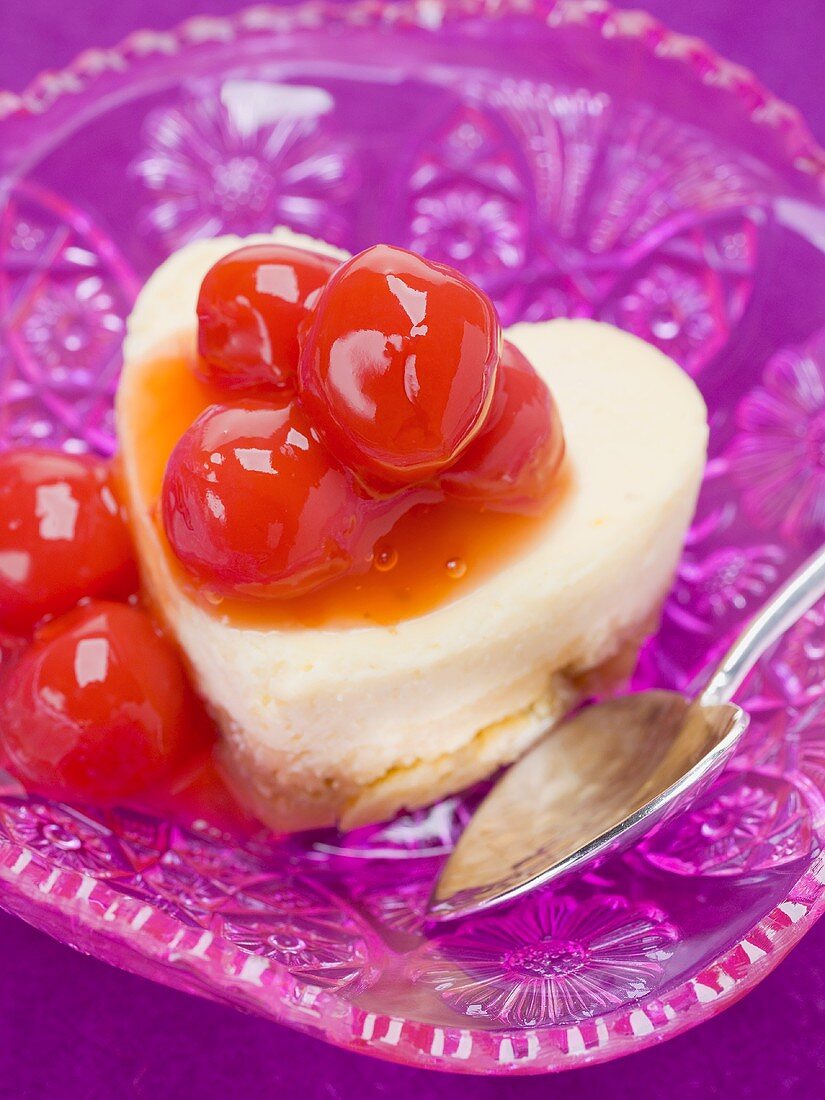 Heart-shaped quark cake with cocktail cherries