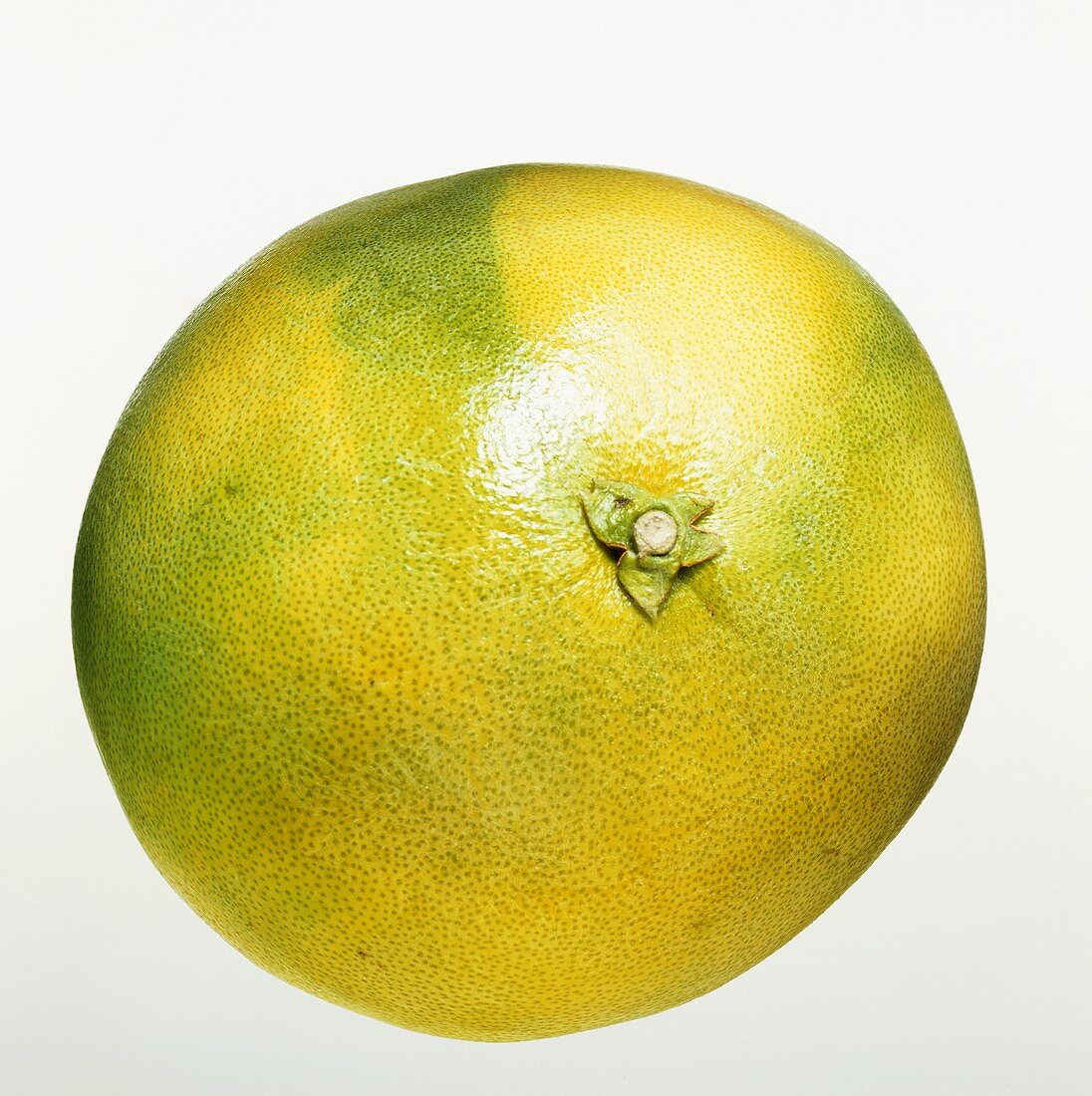 A pomelo against a white background