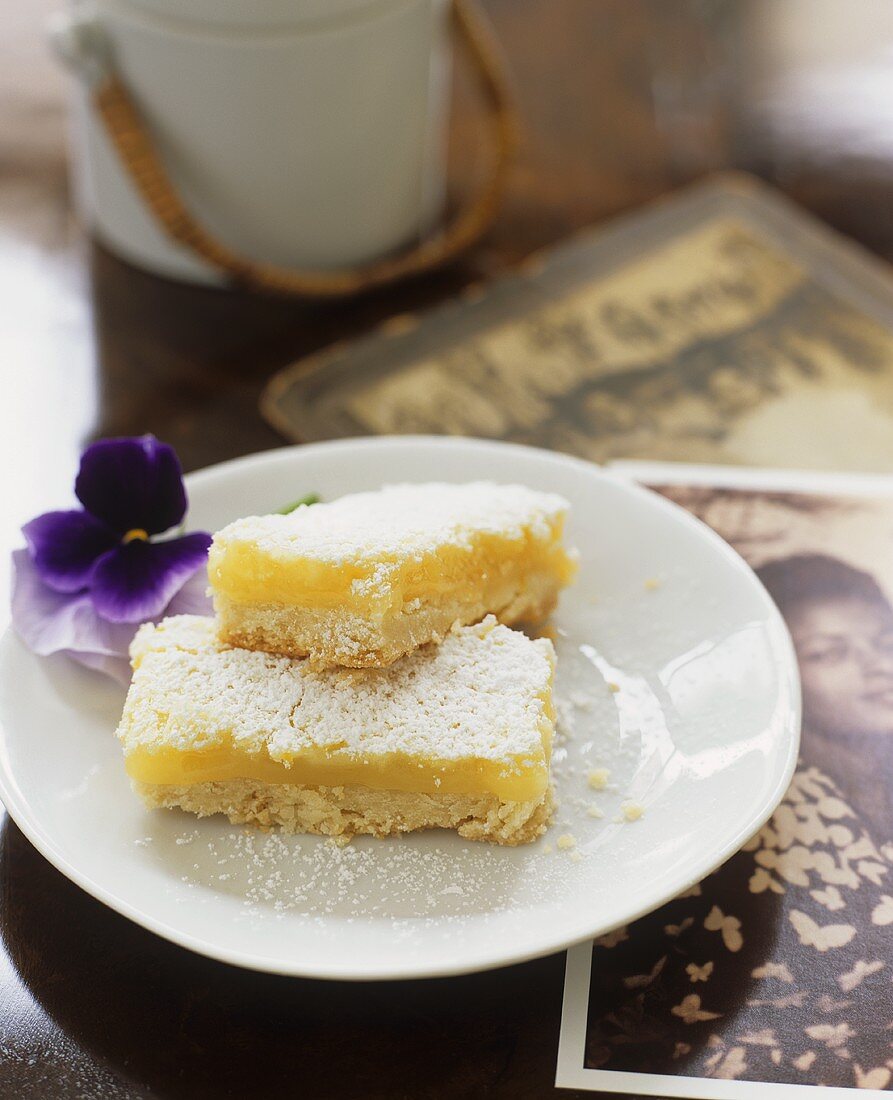 Two lemon slices on plate