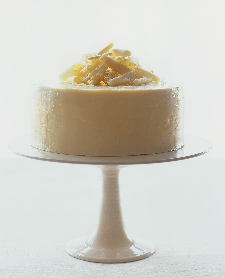 White chocolate cake on cake stand