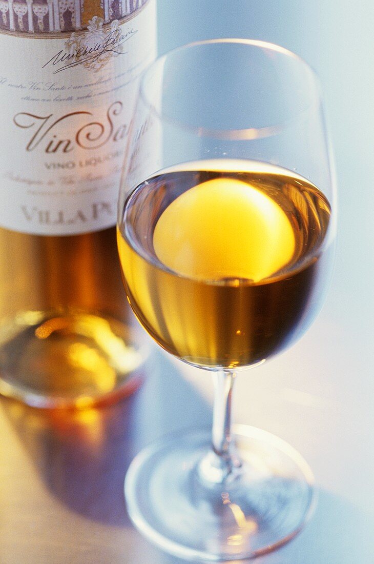 Vin Santo (Dessert wine in glass and bottle, Italy)