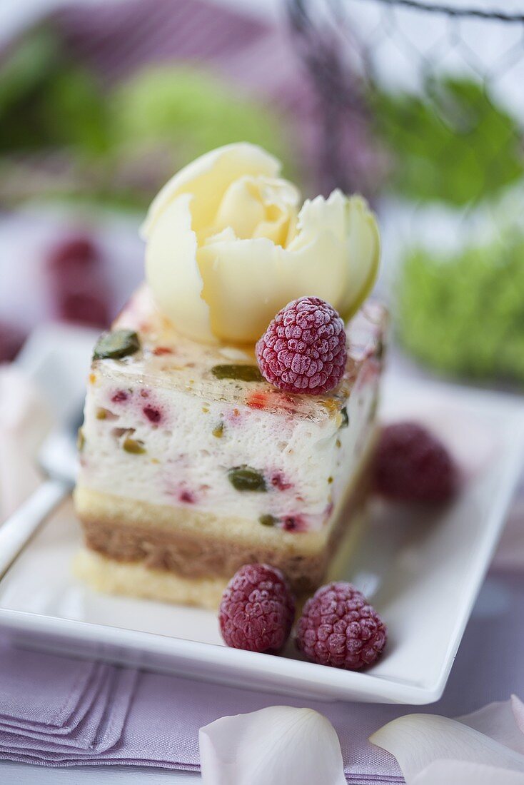 A raspberry and pistachio slice