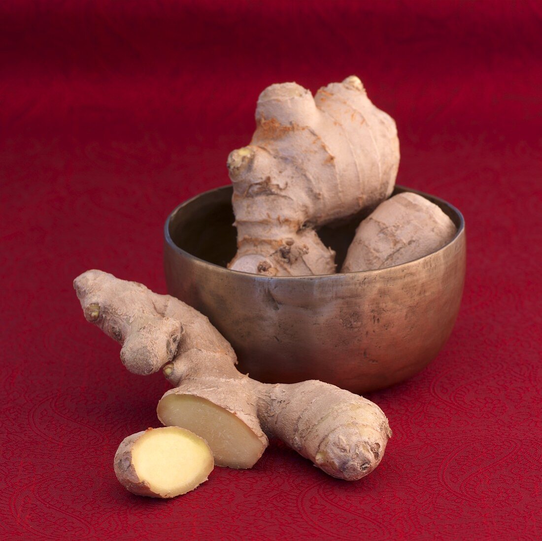 Ginger in a copper bowl and on the side
