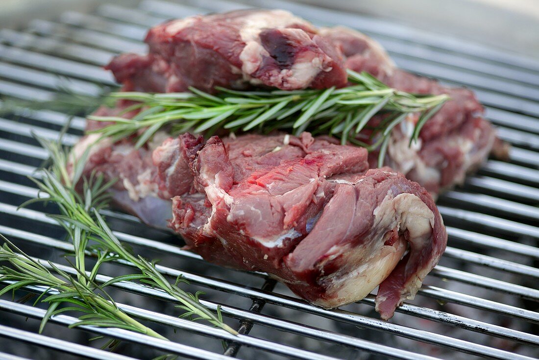 Leg of lamb with rosemary on a barbeque
