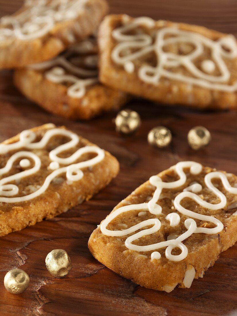 French 'pepper nut' biscuits decorated with icing sugar