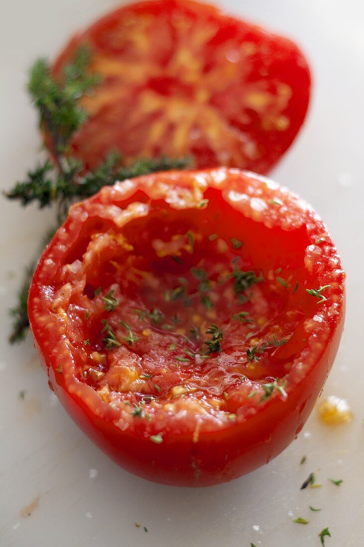 A hollowed out tomato with thyme
