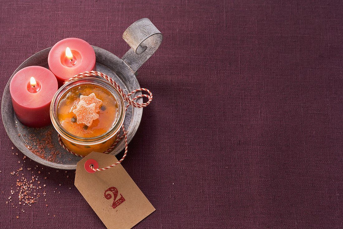 Mandarin marmalade with two candles