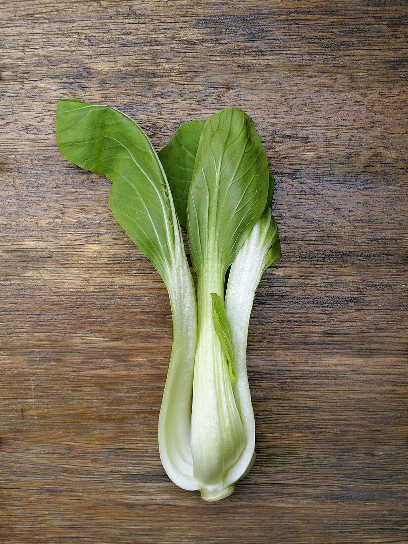 A bok choy on a wooden surface