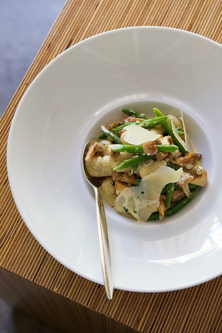 Gnocchi with asparagus, nuts and Parmesan (seen from above)