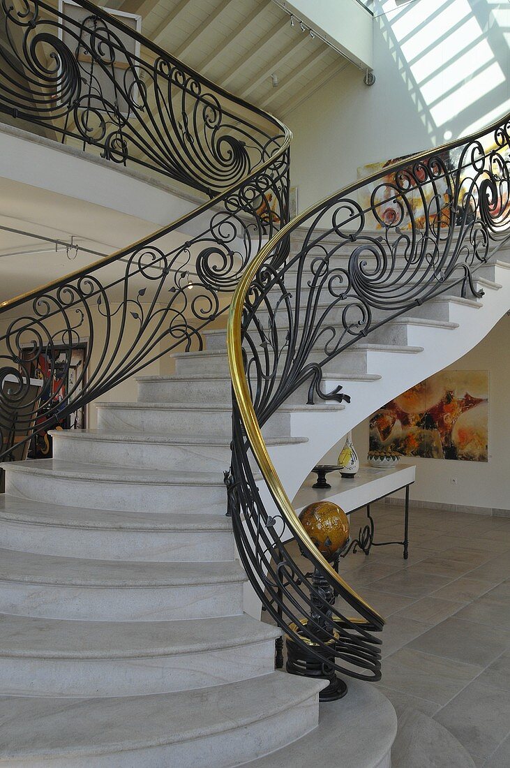 A flight of stairs with a banister rail