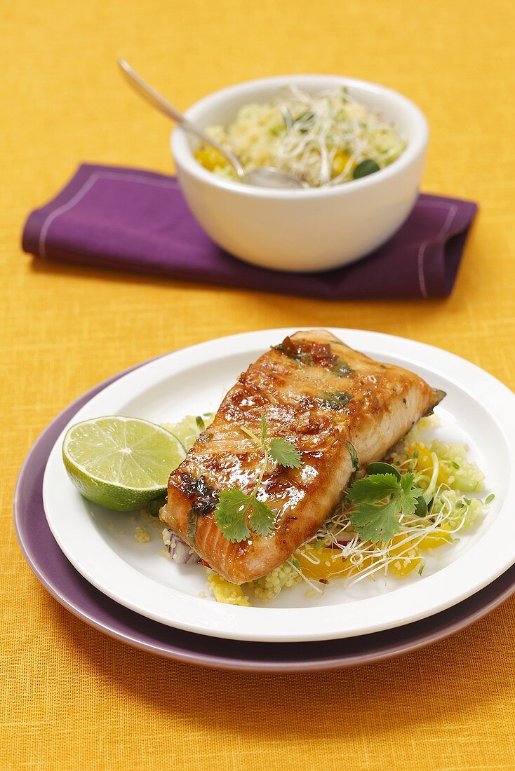 Salmon fillet with a honey glaze on a couscous and beansprout salad