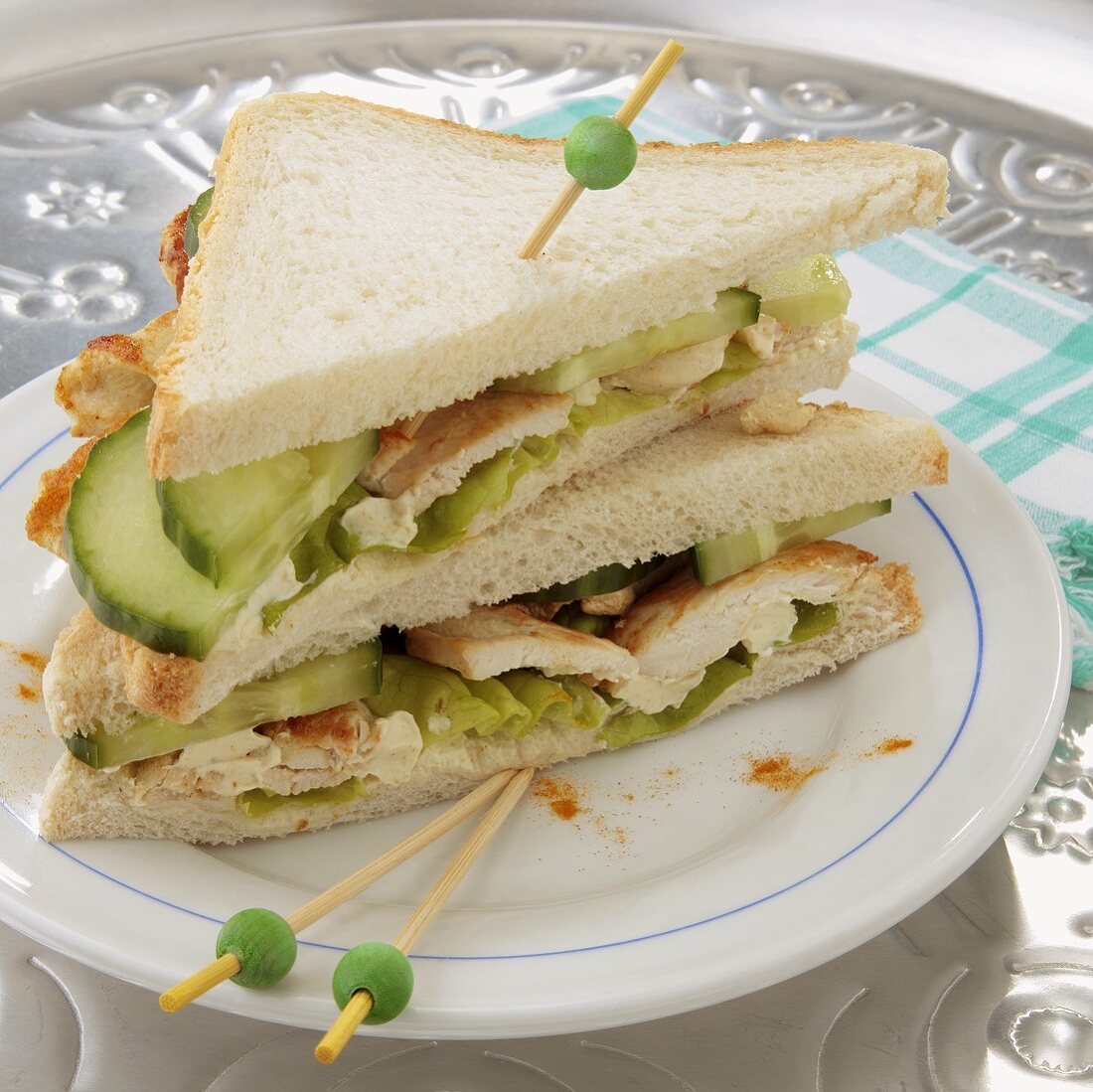 Chicken breast and cucumber sandwiches cut into triangles