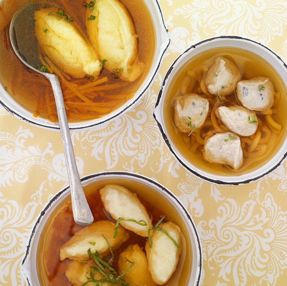 Broth with semolina dumplings, meat dumplings and ricotta dumplings