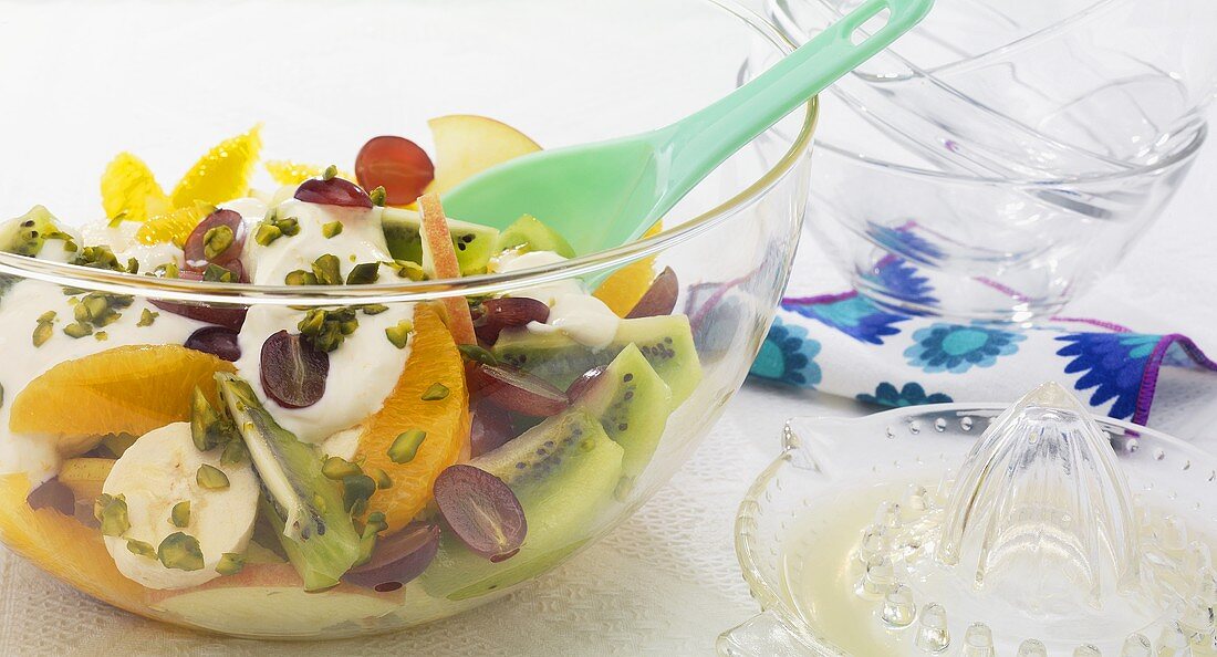 Fruit salad with yogurt and pistachios