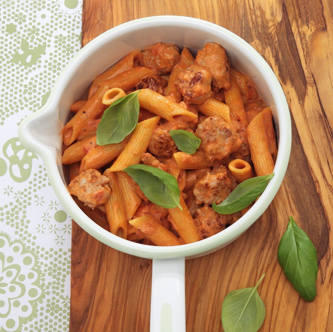 Penne with sausages and a creamy tomato sauce